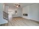 Open concept living room with a modern fireplace and access to the kitchen at 612 Marimba Pike, Mcdonough, GA 30253