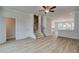 Living room featuring staircase, and connection to kitchen area at 612 Marimba Pike, Mcdonough, GA 30253