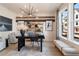 Stylish office with modern light fixture, desk, decorative artwork and large windows at 612 Marimba Pike, Mcdonough, GA 30253
