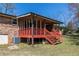 Cozy back porch featuring a classic design, offering a relaxing space for outdoor enjoyment and entertaining at 6348 Garnet Dr, Douglasville, GA 30135