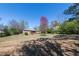 Spacious backyard with mature trees and lush greenery, providing a peaceful and private outdoor oasis at 6348 Garnet Dr, Douglasville, GA 30135