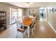 Bright dining area with a wooden table, white chairs, and access to the outdoors at 6348 Garnet Dr, Douglasville, GA 30135