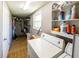 View of a laundry room with a washer, dryer, shelving and storage at 6348 Garnet Dr, Douglasville, GA 30135