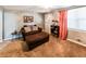 Cozy living area featuring comfortable furniture, a decorative shelf, and neutral decor at 6348 Garnet Dr, Douglasville, GA 30135