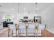Bright kitchen featuring a granite island with bar stool seating and stainless steel appliances at 1395 Windance Lake Dr, Loganville, GA 30052