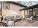Relaxing back patio with comfortable outdoor seating, modern furniture, and sliding glass doors at 3306 Sleepy Se Ln, Smyrna, GA 30080