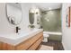 Stylish bathroom featuring a modern vanity, tile backsplash, and walk-in shower at 3306 Sleepy Se Ln, Smyrna, GA 30080