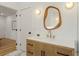 Well-lit bathroom featuring a stylish vanity, modern lighting, and hardwood floors at 3306 Sleepy Se Ln, Smyrna, GA 30080