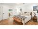 Comfortable bedroom with hardwood floors, natural light, and a view to the ensuite bathroom at 3306 Sleepy Se Ln, Smyrna, GA 30080