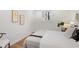Neutral bedroom with white walls, light colored floors, and a large comfy bed at 3306 Sleepy Se Ln, Smyrna, GA 30080