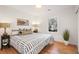 Serene bedroom with natural light, patterned bedding, and hardwood floors at 3306 Sleepy Se Ln, Smyrna, GA 30080