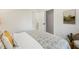Comfortable bedroom showcasing a patterned bedspread and natural light at 3306 Sleepy Se Ln, Smyrna, GA 30080