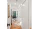 Hallway with white walls, hardwood floors, and closet at 3306 Sleepy Se Ln, Smyrna, GA 30080
