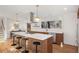 Modern kitchen featuring a large island with seating, sleek appliances, and stylish fixtures at 3306 Sleepy Se Ln, Smyrna, GA 30080