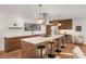 Modern kitchen with a large island, stainless steel appliances, and sleek countertops at 3306 Sleepy Se Ln, Smyrna, GA 30080