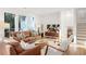 Cozy living room featuring hardwood floors and an open staircase at 3306 Sleepy Se Ln, Smyrna, GA 30080