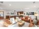 Open-concept living room with hardwood floors, natural light, and a modern kitchen at 3306 Sleepy Se Ln, Smyrna, GA 30080