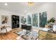 Modern office with high ceilings, lots of natural light, hardwood floors, and stylish decor at 3306 Sleepy Se Ln, Smyrna, GA 30080