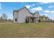 Expansive backyard featuring a well-maintained lawn and picturesque views of the surrounding neighborhood at 4315 Balsam Bark Dr, Cumming, GA 30028