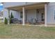 Relaxing backyard patio featuring outdoor seating, a grill, and a cozy ambiance for entertaining at 4315 Balsam Bark Dr, Cumming, GA 30028