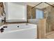 Luxurious bathroom with a soaking tub, tiled shower, and elegant fixtures, providing a spa-like experience at 4315 Balsam Bark Dr, Cumming, GA 30028