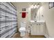 Cozy bathroom with tile flooring, a vanity, and a shower/tub combination at 4315 Balsam Bark Dr, Cumming, GA 30028