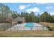 Community pool area with ample seating, perfect for relaxing and enjoying the outdoors at 4315 Balsam Bark Dr, Cumming, GA 30028