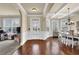 Light-filled dining room with hardwood floors, large windows, and elegant chandelier, perfect for Gathering gatherings at 4315 Balsam Bark Dr, Cumming, GA 30028