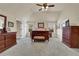 Large main bedroom with carpeting, windows, ceiling fan, and matching furniture set at 4315 Balsam Bark Dr, Cumming, GA 30028