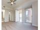 Spacious bedroom with a ceiling fan, balcony access, an ensuite bathroom, and walk-in closet at 1820 Peachtree Nw St # 608, Atlanta, GA 30309