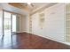 Bedroom featuring a built-in Murphy bed, custom shelving, and hardwood floors, optimizing space and style at 1820 Peachtree Nw St # 608, Atlanta, GA 30309