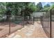 Outdoor dog park with secure fence, walking path and bench for residents at 1820 Peachtree Nw St # 608, Atlanta, GA 30309
