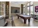 Game room with pool table, lounge seating, and TV for community members at 1820 Peachtree Nw St # 608, Atlanta, GA 30309