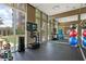 Well-equipped gym with mirrored wall, mounted tv and fitness equipment at 1820 Peachtree Nw St # 608, Atlanta, GA 30309
