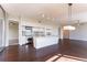 Inviting open-concept kitchen and dining area features hardwood floors and modern lighting at 1820 Peachtree Nw St # 608, Atlanta, GA 30309
