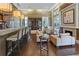 Well-lit lounge with bar, fireplace, plenty of seating, and high ceilings at 1820 Peachtree Nw St # 608, Atlanta, GA 30309