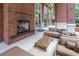 Comfortable outdoor lounge area with a brick fireplace and ample seating at 1820 Peachtree Nw St # 608, Atlanta, GA 30309