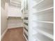 Organized walk-in closet with custom shelving and storage solutions, maximizing space and functionality at 1820 Peachtree Nw St # 608, Atlanta, GA 30309