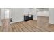 Finished basement with wet bar featuring black cabinets, stone countertops, and an undermount sink at 2335 Flat Stone Dr, Cumming, GA 30041