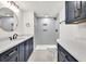 Bathroom features a double vanity with white countertops and tile shower at 2335 Flat Stone Dr, Cumming, GA 30041