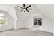 Bright bedroom featuring vaulted ceilings, neutral colors, and large windows at 2335 Flat Stone Dr, Cumming, GA 30041