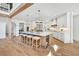 Bright, white kitchen with a large island, marble countertops, and stainless steel appliances in a modern home at 2335 Flat Stone Dr, Cumming, GA 30041