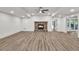 Spacious living room with stone fireplace and hardwood floors, great for entertaining at 2335 Flat Stone Dr, Cumming, GA 30041