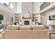 Bright living room boasts a stone fireplace, built-ins, hardwood floors, and plenty of natural light at 2335 Flat Stone Dr, Cumming, GA 30041