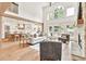 Open floorplan with fireplace, great room, kitchen and breakfast nook with hardwood flooring throughout at 2335 Flat Stone Dr, Cumming, GA 30041