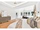 Spacious main bedroom boasts hardwood floors, sitting area, stone fireplace, and large windows with wooded views at 2335 Flat Stone Dr, Cumming, GA 30041