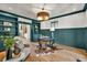 Stylish home office with custom built-ins, designer lighting, and hardwood floors at 2335 Flat Stone Dr, Cumming, GA 30041