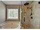 Luxurious bathroom with separate tub and frameless glass shower, and tiled walls at 7040 Shady Oak Ln, Cumming, GA 30040