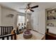 Playful Bedroom with crib, bookcase, and ball pit for a fun and inviting space at 7040 Shady Oak Ln, Cumming, GA 30040
