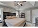 Bedroom features neutral tones, tray ceiling, and lots of natural light at 7040 Shady Oak Ln, Cumming, GA 30040